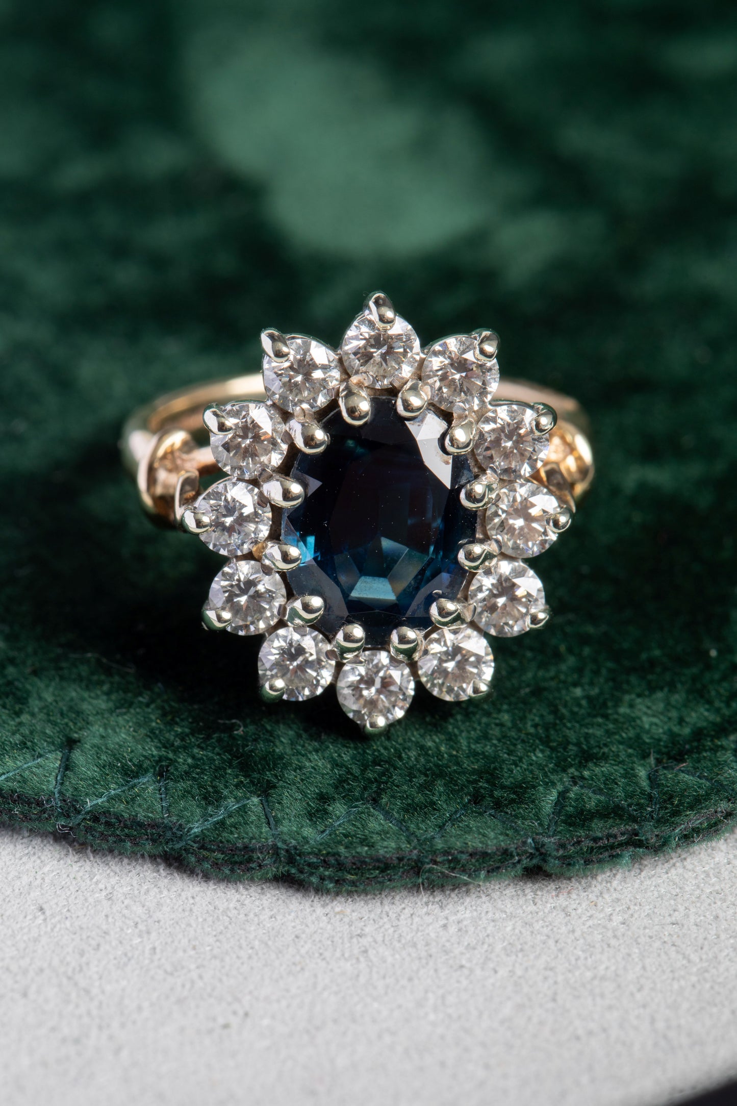 Oval Sapphire and Round Brilliant Cut Diamond Cluster Ring