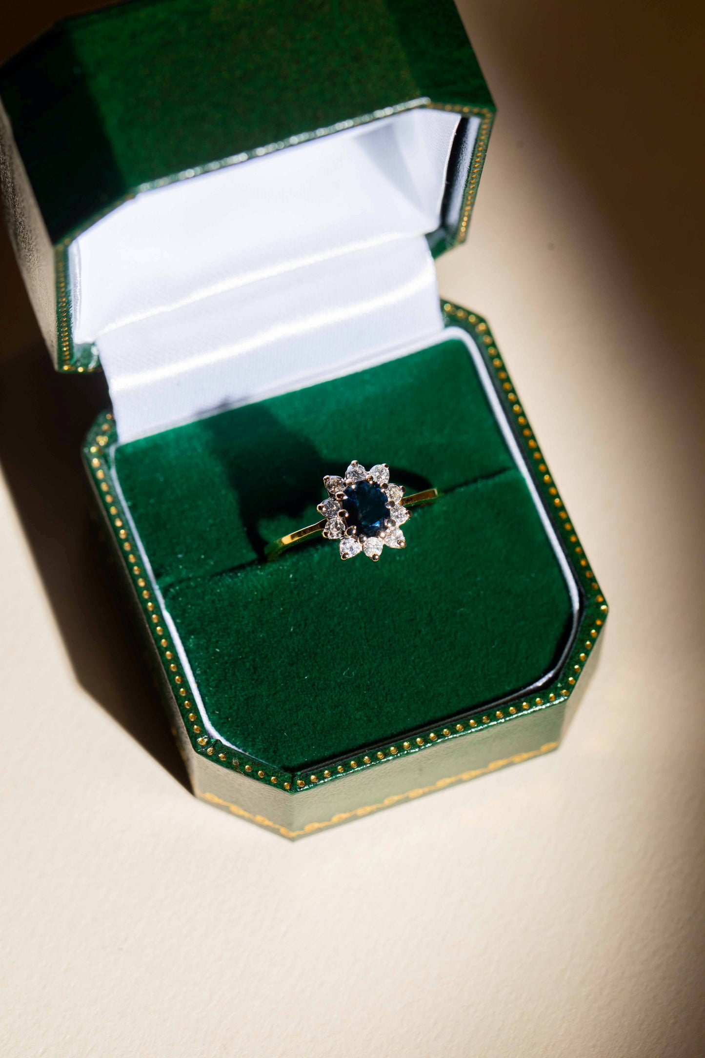 Sapphire and Round Brilliant Cut Diamond Cluster Ring