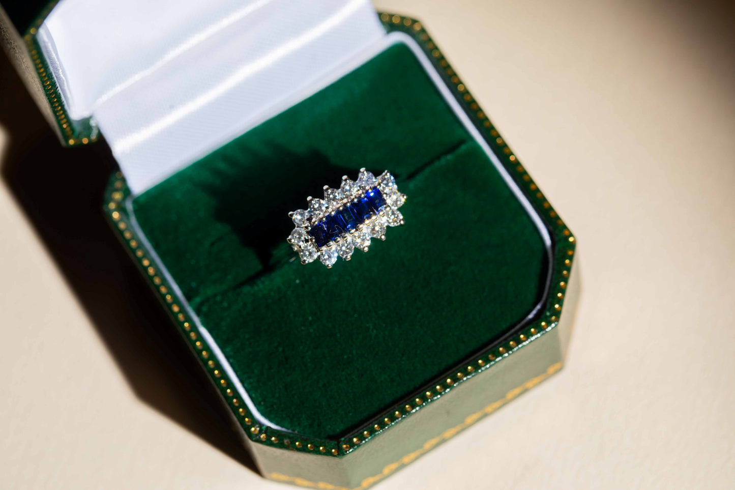 Sapphire and Round Brilliant Cut Diamond Cluster Ring