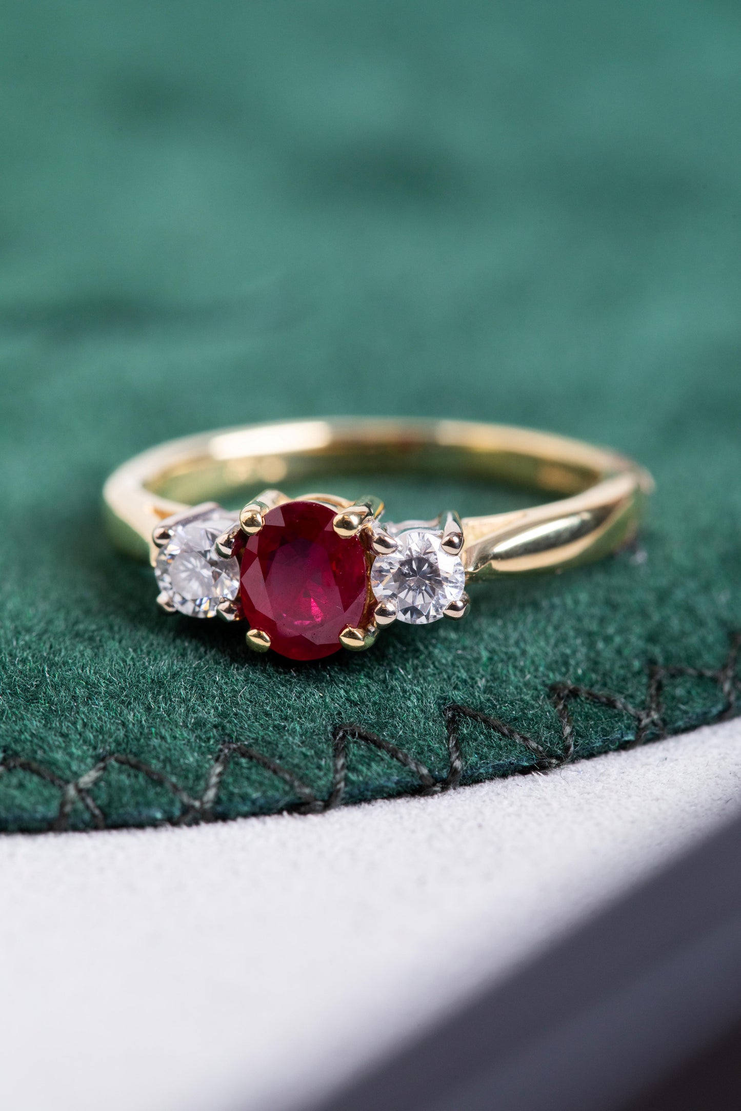 Oval Ruby and Round Brilliant Cut Diamond 3 Stone Ring