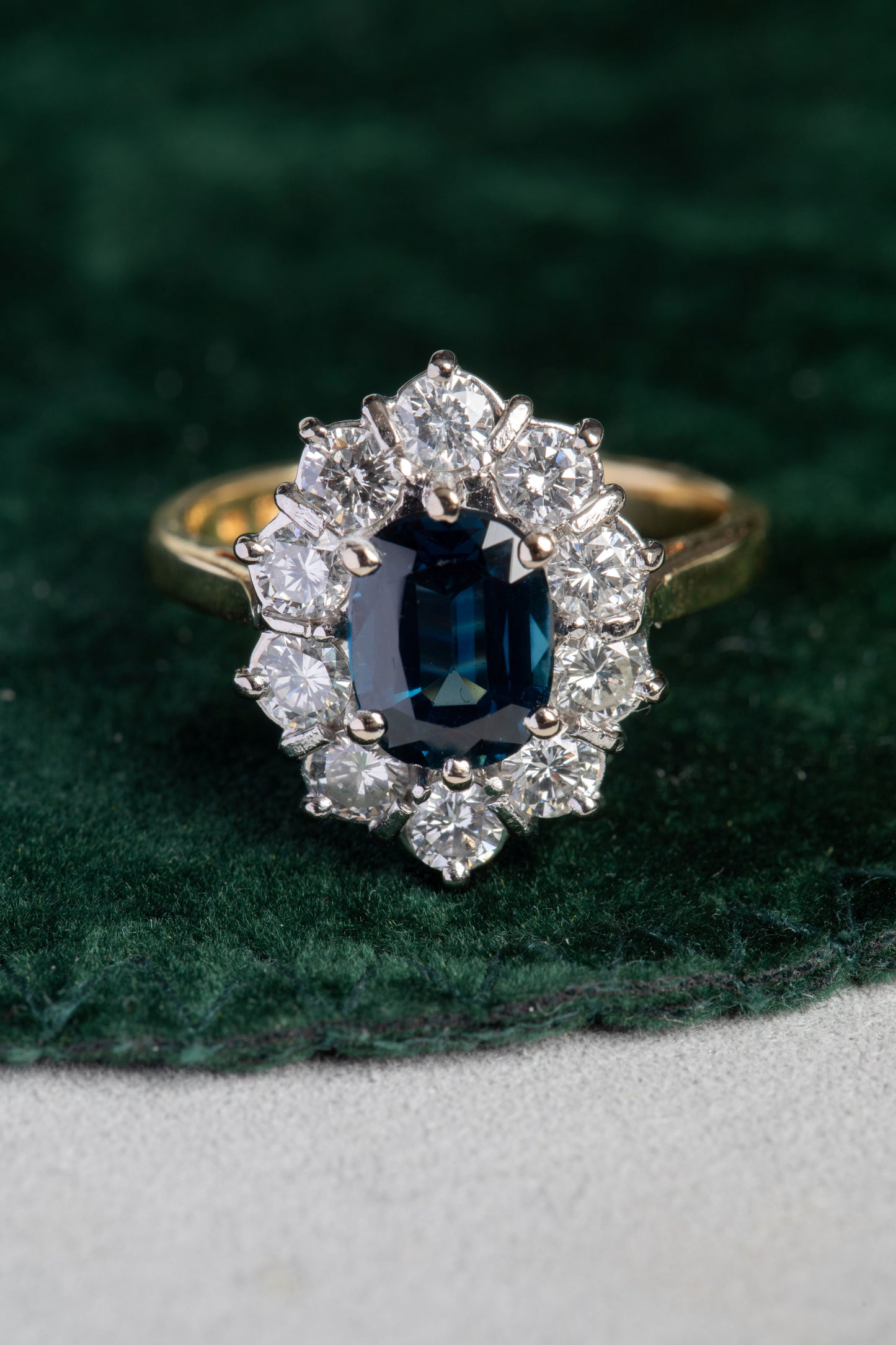 Oval Sapphire and Round Brilliant Cut Diamond Cluster Ring