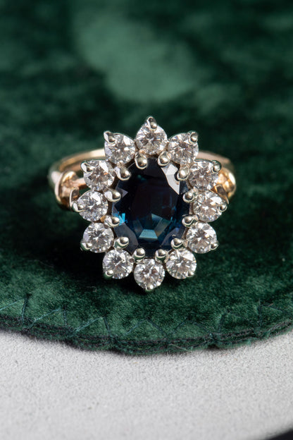 Oval Sapphire and Round Brilliant Cut Diamond Cluster Ring