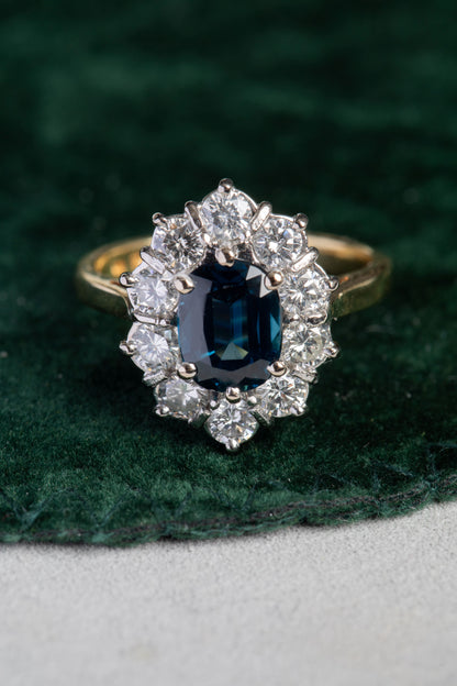 Oval Sapphire and Round Brilliant Cut Diamond Cluster Ring