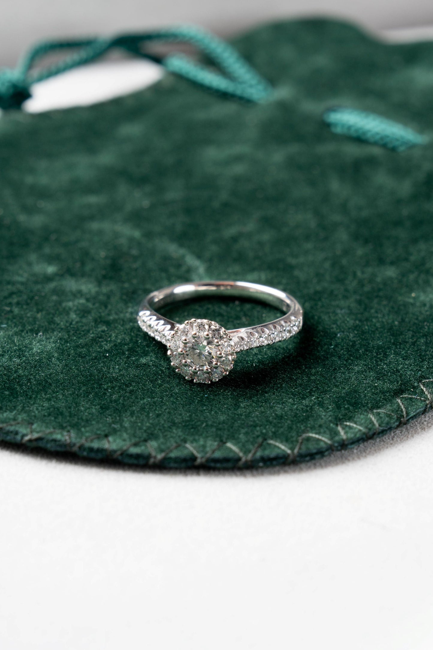 Round Brilliant Cut Diamond Halo Ring with Diamond set shoulders