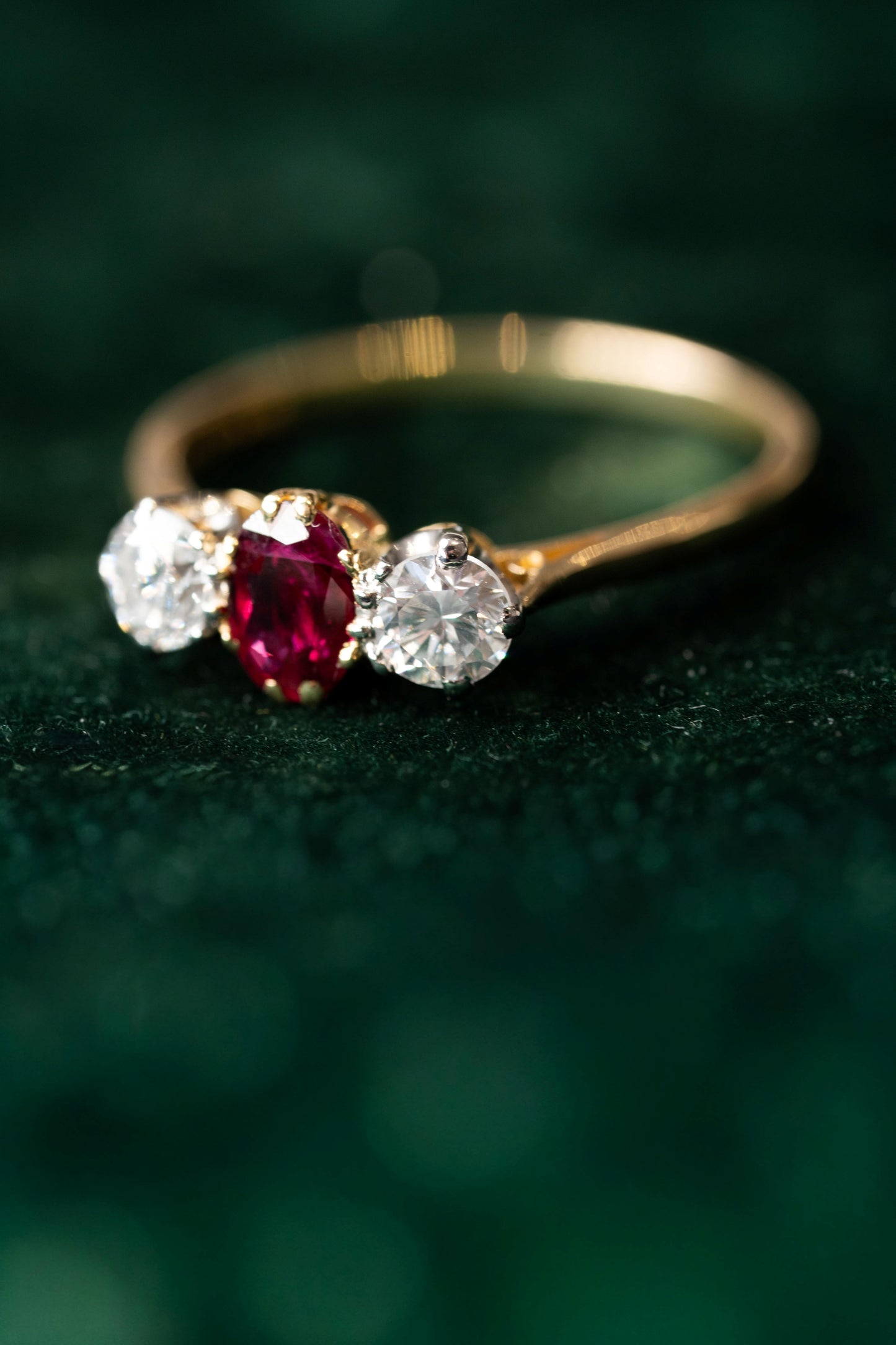 Oval Ruby and Round Brilliant Cut Diamond 3 Stone Ring