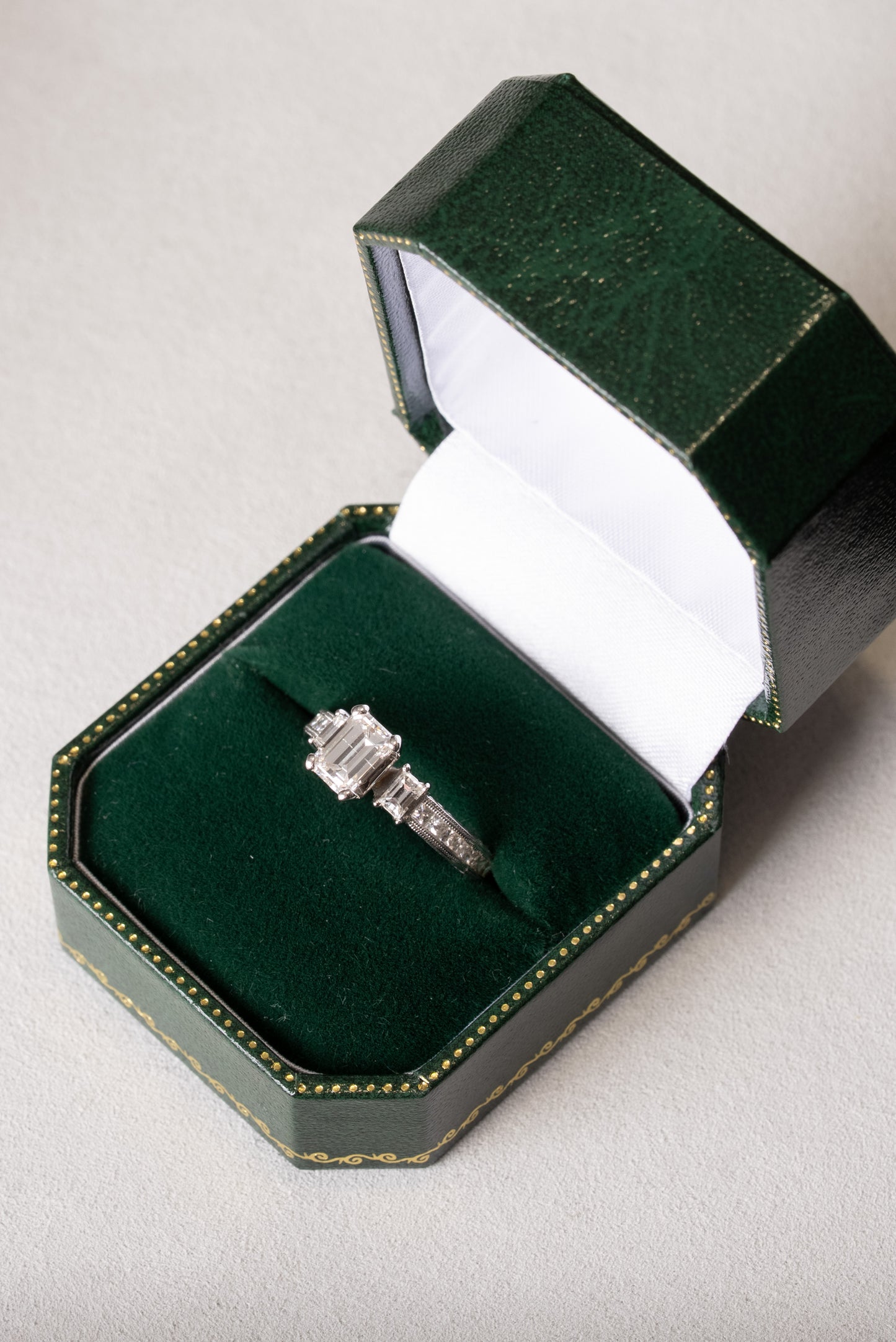 Emerald Cut Diamond 3 Stone Ring with Princess Cut Diamond set shoulders