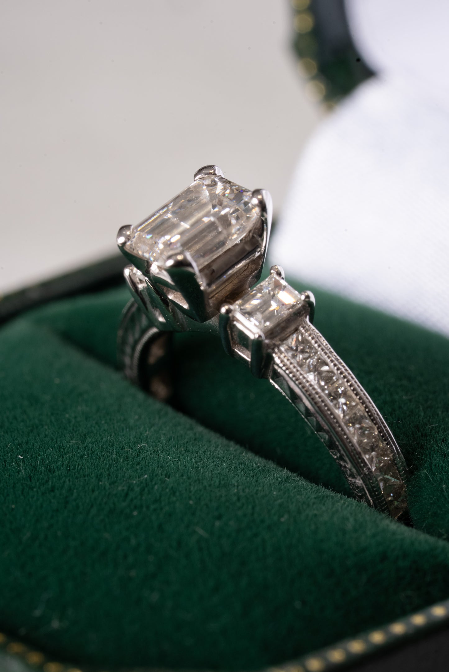 Emerald Cut Diamond 3 Stone Ring with Princess Cut Diamond set shoulders