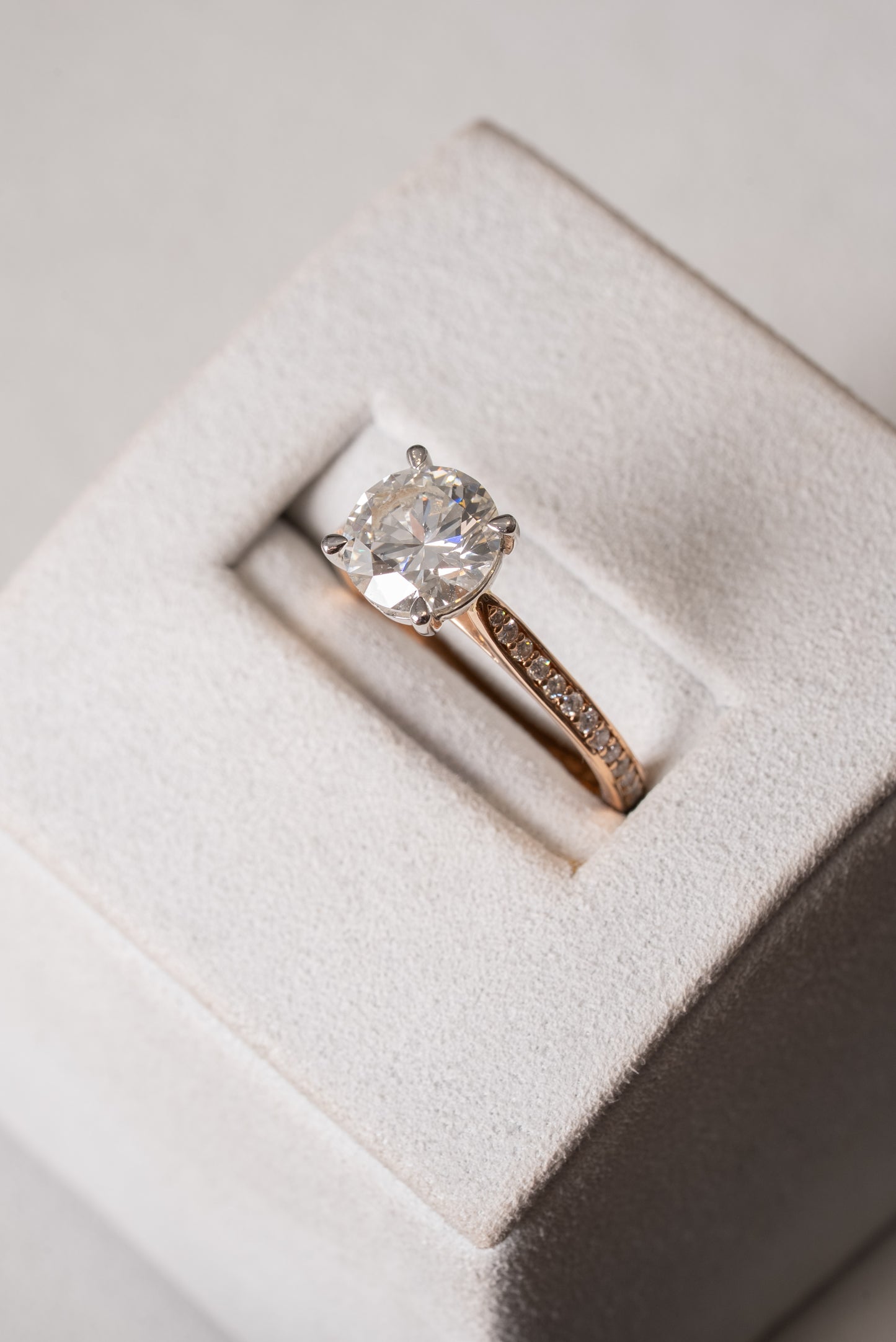 Round Brilliant Cut Diamond Solitaire with Diamond set shoulders