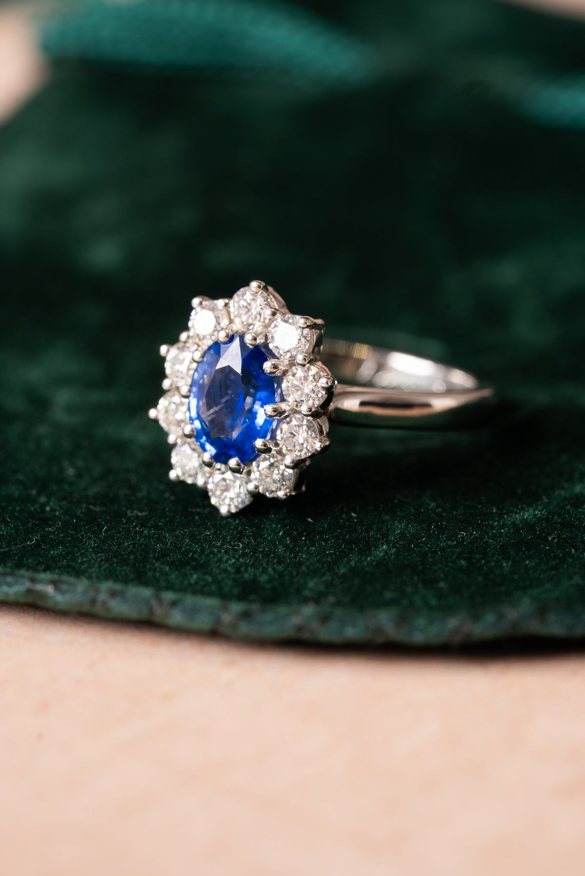 Platinum, Oval Shaped Sapphire with Round Brilliant Cut Diamonds