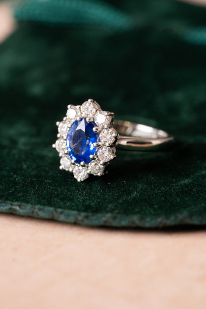 Platinum, Oval Shaped Sapphire with Round Brilliant Cut Diamonds