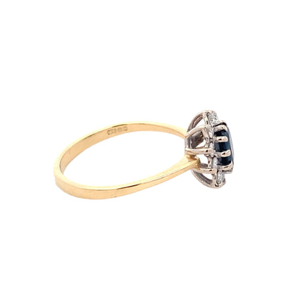 Sapphire and Round Brilliant Cut Diamond Cluster Ring