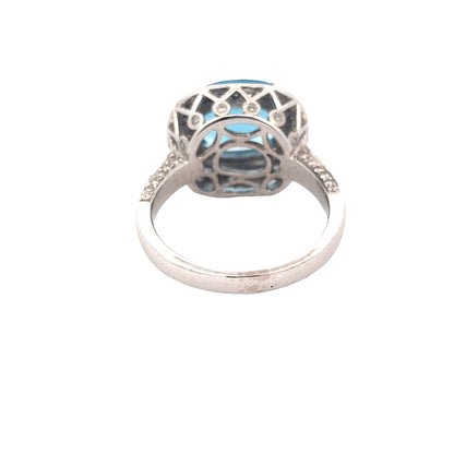 Blue Topaz with halo of Diamonds and Diamond set shoulders Ring