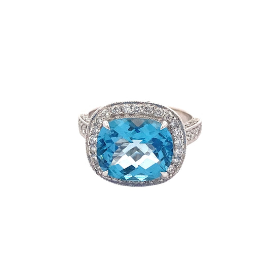 Blue Topaz with halo of Diamonds and Diamond set shoulders Ring