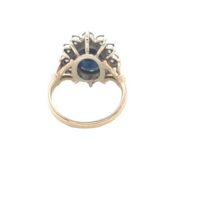 Oval Sapphire and Round Brilliant Cut Diamond Cluster Ring