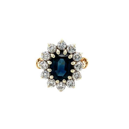 Oval Sapphire and Round Brilliant Cut Diamond Cluster Ring