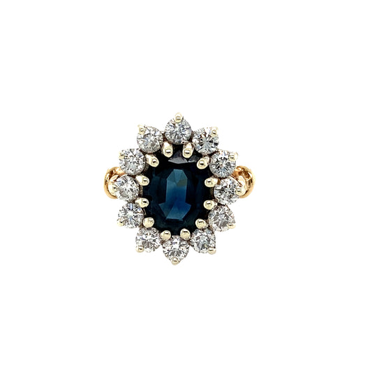 Oval Sapphire and Round Brilliant Cut Diamond Cluster Ring