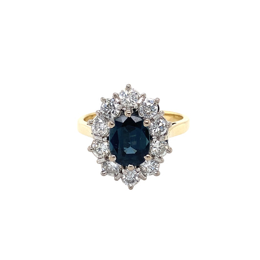 Oval Sapphire and Round Brilliant Cut Diamond Cluster Ring