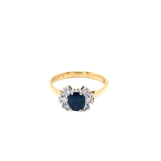 Oval Sapphire and Round Brilliant Cut Diamond Cluster Ring