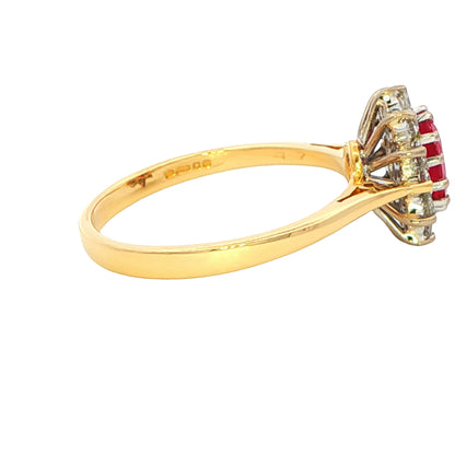 Oval Ruby and Round Brilliant Cut Diamond Cluster Style Ring