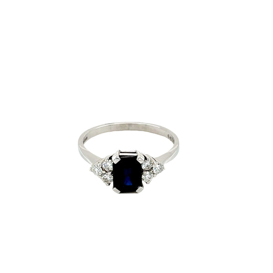 Sapphire and 6 Round Brilliant Cut Diamond Ring