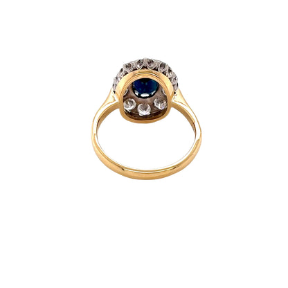 Oval Sapphire and Round Brilliant Cut Diamond Cluster Style Ring