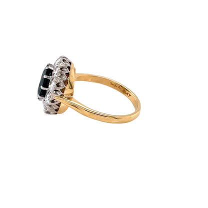 Oval Sapphire and Round Brilliant Cut Diamond Cluster Style Ring