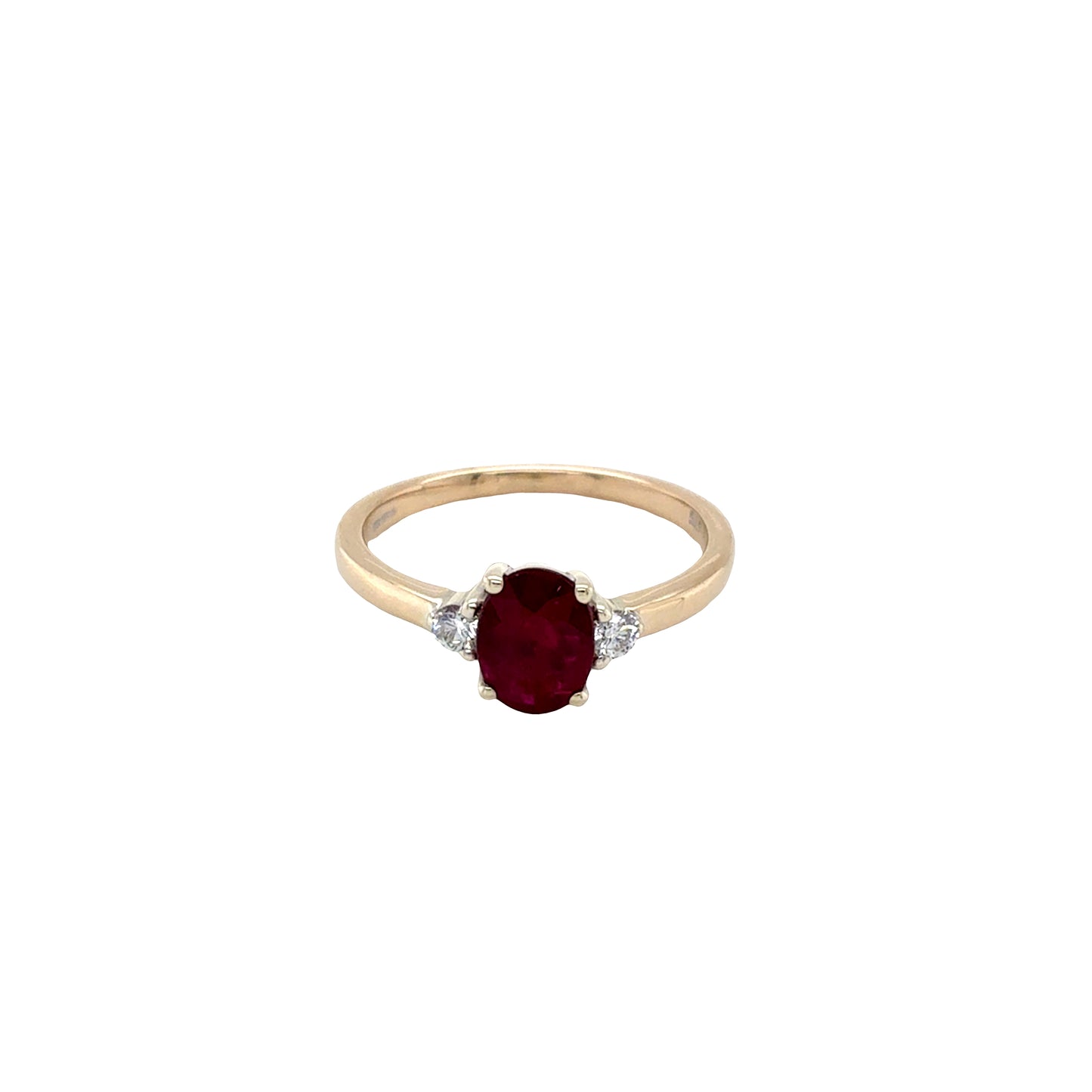 Oval shaped Ruby and Round Diamonds 3 Stone Ring