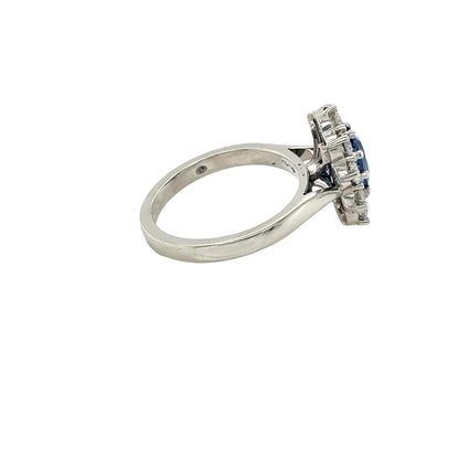 Platinum, Oval Shaped Sapphire with Round Brilliant Cut Diamonds