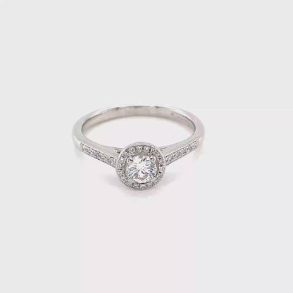 Round Brilliant Cut Diamond Halo Ring with Diamond set shoulders