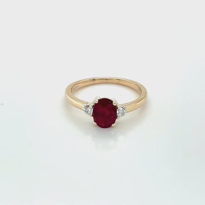 Oval shaped Ruby and Round Diamonds 3 Stone Ring