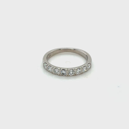 Platinum, Round Brilliant Cut Diamond Ring with half rub-over setting