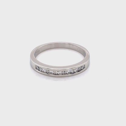 Round Brilliant Cut and Baguette Cut Diamond Channel Set Ring