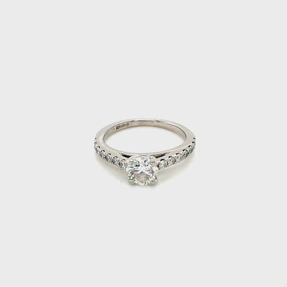 Platinum, Round Brilliant Cut Diamond Solitaire with Diamond set shoulders