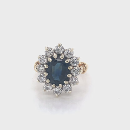 Oval Sapphire and Round Brilliant Cut Diamond Cluster Ring