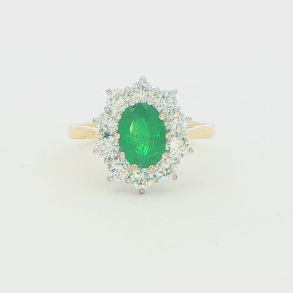 Oval Emerald and Round Brilliant Cut Cluster Ring