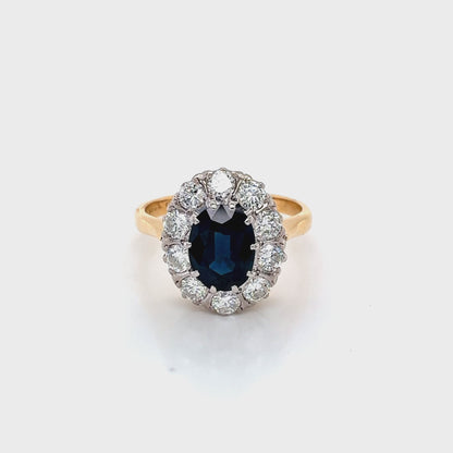 Oval Sapphire and Round Brilliant Cut Diamond Cluster Style Ring