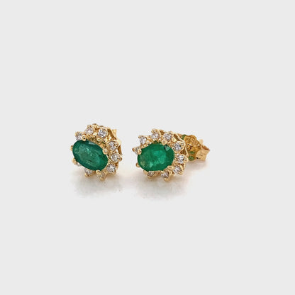 Oval shaped Emerald and Round Brilliant Cut Diamond Cluster Style Earrings