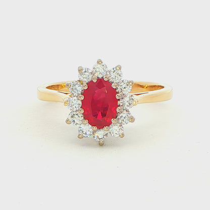 Oval Ruby and Round Brilliant Cut Diamond Cluster Style Ring
