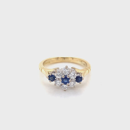 Round Sapphire and Round Brilliant Cut Diamond Cluster Style Ring