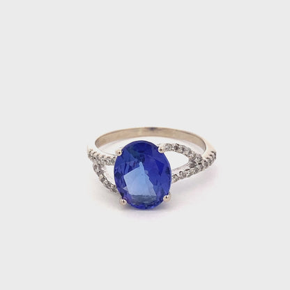 Oval Tanzanite with Diamond set split shoulders Ring